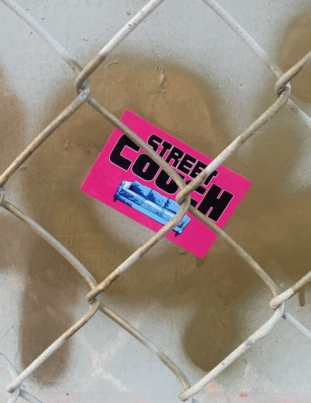 pink street couch sticker on ballona creek bike path