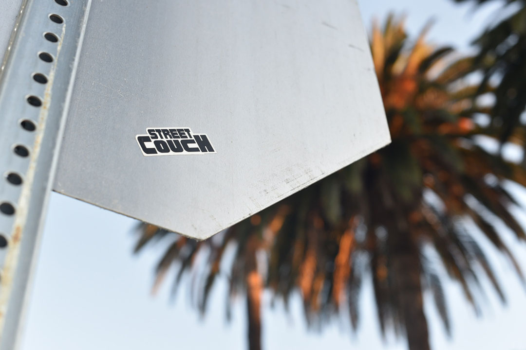 street couch sticker in venice california with palm trees